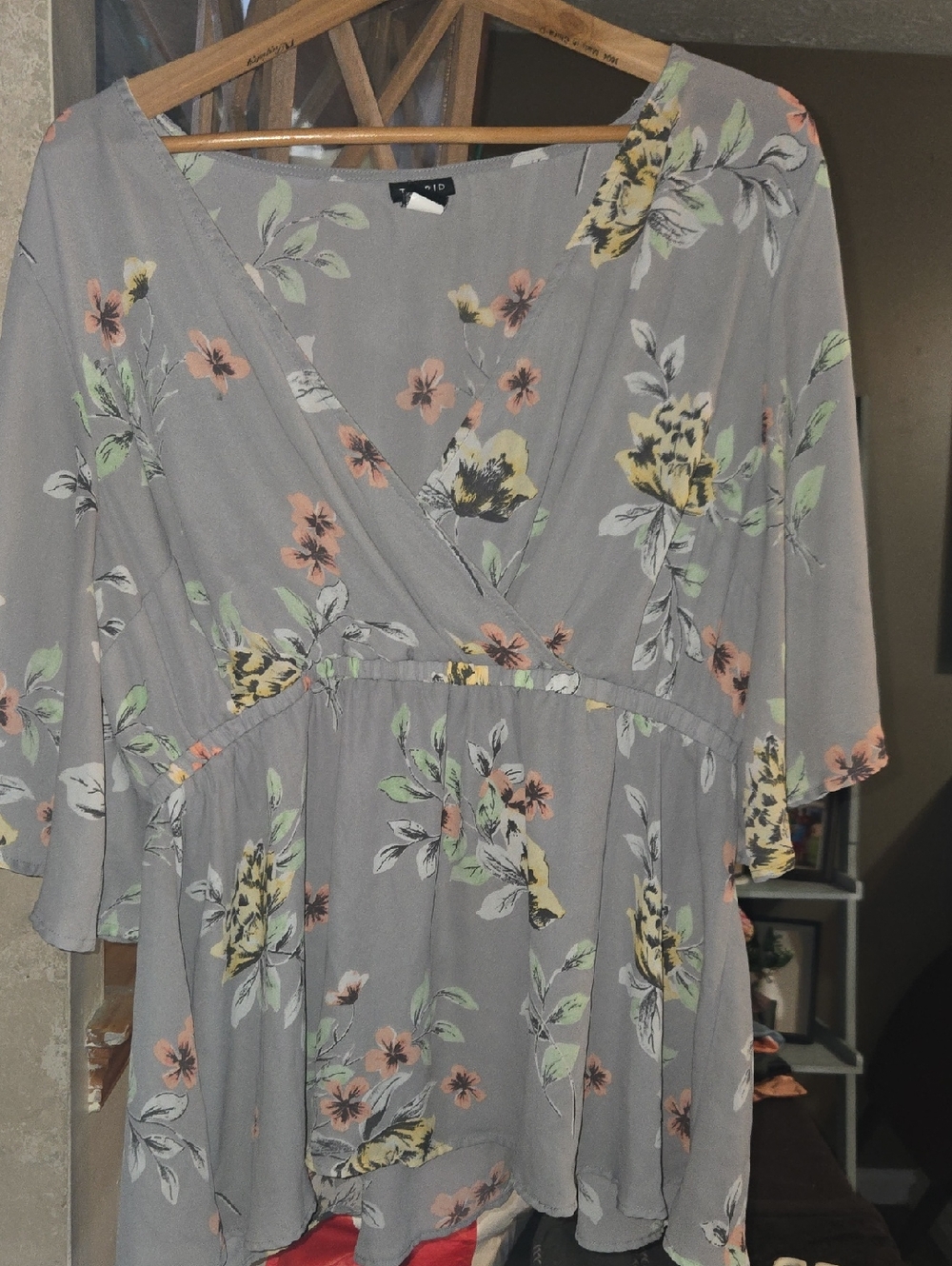 torrid light gray blouse with subtle floral accents